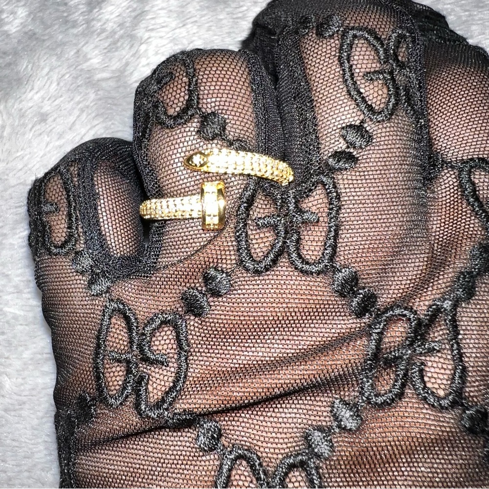 Adjustable Yellow Gold plated nail ring with cubic zirconia diamonds.